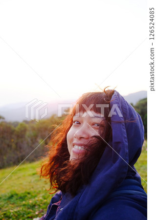 Traveler Asian woman wearing jacket and hood smiling on blue sky with sunrise in winter on the hill with valley Doi Luang Chiang Dao mountain view, Chiangmai of Thailand Traveler Asian woman wearing jacket and hood smiling on blue sky with sunrise in winter on the hill with valley Doi Luang Chiang Dao mountain view, Chiangmai of Thailand 126524085