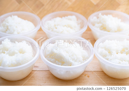Cooked rice stored in a storage container 126525070