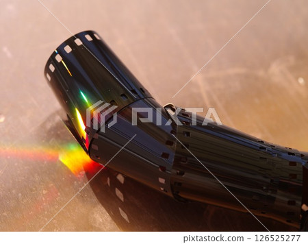 Roll of film is shown with a rainbow effect Roll of film is shown with a rainbow effect 126525277
