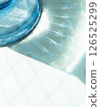 Ice in a glass container 126525299