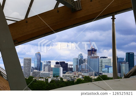 View of La Défense, a suburb of Paris, from the terrace of the Fondation Louis Vuitton in the Bois de Boulogne View of La Défense, a suburb of Paris, from the terrace of the Fondation Louis Vuitton in the Bois de Boulogne 126525921