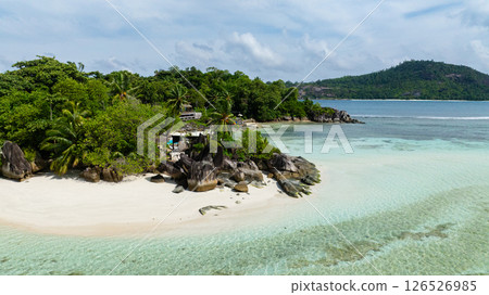 Sandy beach with clear water and rocky outcrops. Seychelles, Mahe. Sandy beach with clear water and rocky outcrops. Seychelles, Mahe. 126526985