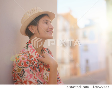 Woman strolls through colorful streets of Spanish coastal town Woman strolls through colorful streets of Spanish coastal town 126527643
