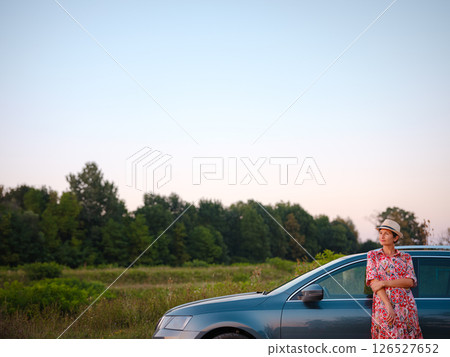 Traveler woman drives car through scenic countryside of Croatia 126527652
