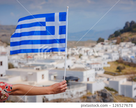 View of Greek flag waving in air serene Mediterranean vibe. 126527678
