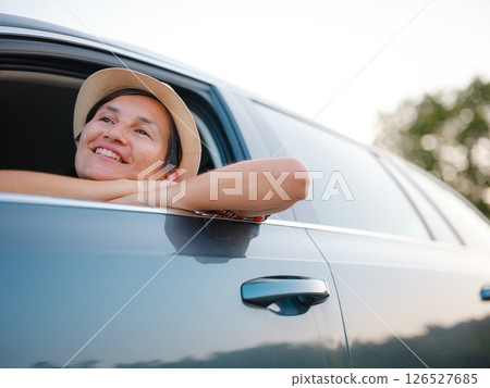 Traveler woman drives car through scenic countryside of Croatia Traveler woman drives car through scenic countryside of Croatia 126527685