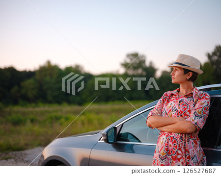 Traveler woman drives car through scenic countryside of Croatia 126527687