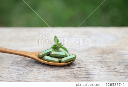 Herbal capsules from green herbal on leaf for healthy eating in daily life. capsules from watercress. 126527741