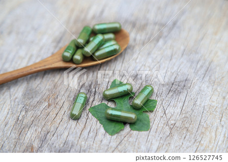 Herbal capsules from green herbal on leaf for healthy eating in daily life 126527745