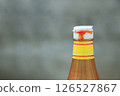 close up view of dirty tomato bottle cap with sauce from using in daily life 126527867