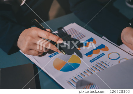 Expert woman asian female people review data number costing managerial account prepare monthly actual cost variance report at tax audit office. ESG sheet budget control ERP process service project. 126528303