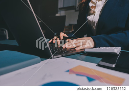 Expert woman asian female people review data number costing managerial account prepare monthly actual cost variance report at tax audit office. ESG sheet budget control ERP process service project. 126528332