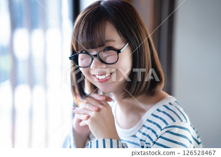 A young woman wearing glasses A young woman wearing glasses 126528467