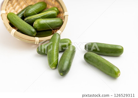 Mini cucumbers served in a small colander Mini cucumbers served in a small colander 126529311