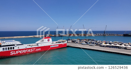 Bari, Italy - May 10, 2025: Aerial view of a Superfast Ferry. It is a Greece-based ferry company. The ship is anchored in the port of the Apulian city. Bari, Italy - May 10, 2025: Aerial view of a Superfast Ferry. It is a Greece-based ferry company. The ship is anchored in the port of the Apulian city. 126529436