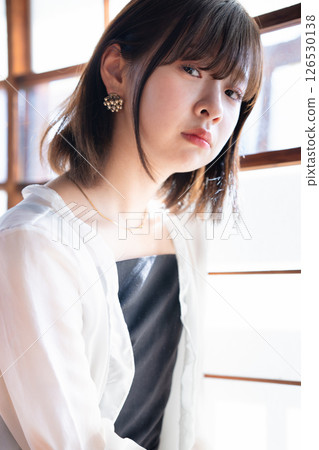 A young woman with a feminine atmosphere relaxing in a Japanese-style room A young woman with a feminine atmosphere relaxing in a Japanese-style room 126530138
