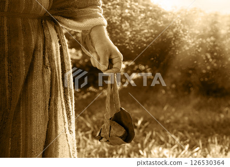 Man's hand with an old sling 126530364