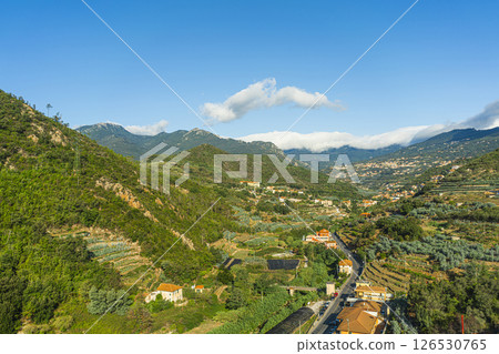 Rural valley between Ligurian hills with terraced fields and houses Rural valley between Ligurian hills with terraced fields and houses 126530765