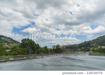 Scenic Road in Liguria with Hilltop Town View 126530770