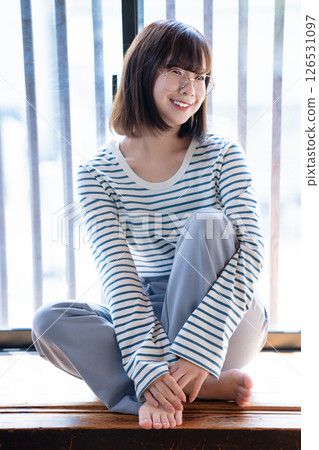 Rough young woman wearing glasses 126531097