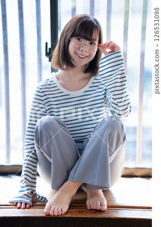 Rough young woman wearing glasses 126531098