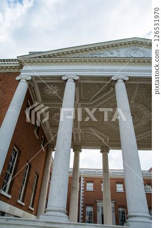 Osterley House, a historic building with red bricks and white stone pillars, on the outskirts of London Osterley House, a historic building with red bricks and white stone pillars, on the outskirts of London 126531970