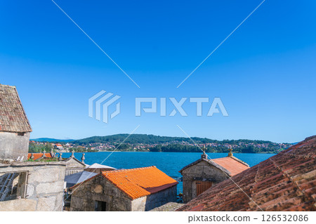 Scenic views of traditional buildings and coastal landscape. Combarro, Spain. Scenic views of traditional buildings and coastal landscape. Combarro, Spain. 126532086
