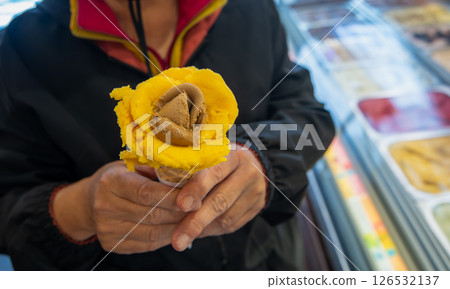 Hand Holding Artisan Gelato Rose Lisbon Portugal. Hand Holding Artisan Gelato Rose Lisbon Portugal. 126532137
