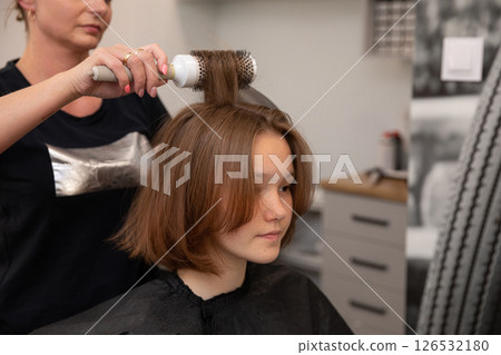 The Salon Hair Styling Process involves the expertise of a Professional Hairdresser The Salon Hair Styling Process involves the expertise of a Professional Hairdresser 126532180