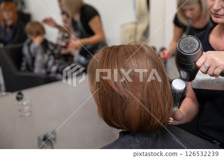 Experience a modern hair salon that offers professional hair styling and exceptional service 126532239