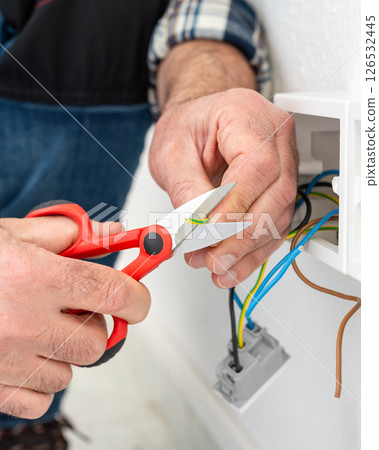 Electrician at work on a residential electrical system. Electricity. 126532445