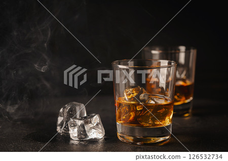 Whiskey with ice in glasses Whiskey with ice in glasses 126532734