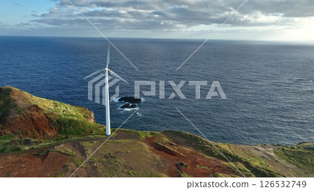 Solar energy panels photovoltaic cell and wind power plants on the seashore landscape for production of renewable green energy Solar energy panels photovoltaic cell and wind power plants on the seashore landscape for production of renewable green energy 126532749