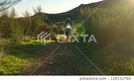Enduro Motorcycle Rider Driving in High Mountain Landscape, Madeira Island , Portugal Enduro Motorcycle Rider Driving in High Mountain Landscape, Madeira Island , Portugal 126532760