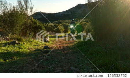 Enduro Motorcycle Rider Driving in High Mountain Landscape, Madeira Island , Portugal 126532762