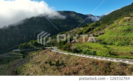 Motorcycle Rider Driving in High Mountain Landscape, Madeira Island , Portugal 126532764