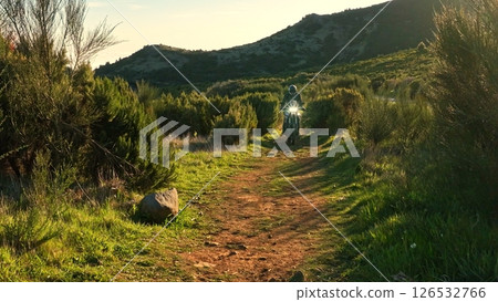 Enduro Motorcycle Rider Driving in High Mountain Landscape, Madeira Island , Portugal Enduro Motorcycle Rider Driving in High Mountain Landscape, Madeira Island , Portugal 126532766