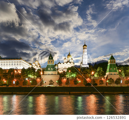 Night view of the Moskva River and Kremlin, Russia, Moscow (most popular view). Against the background of a beautiful sky with clouds Night view of the Moskva River and Kremlin, Russia, Moscow (most popular view). Against the background of a beautiful sky with clouds 126532891