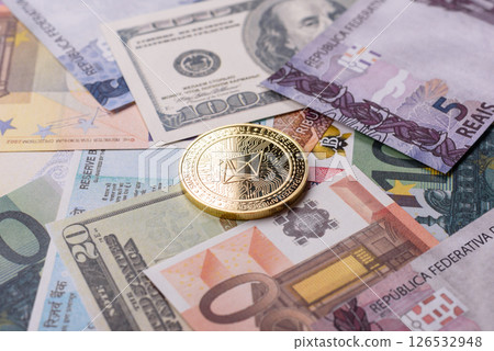 Round metal ethereum on a background of paper banknotes Round metal ethereum on a background of paper banknotes 126532948