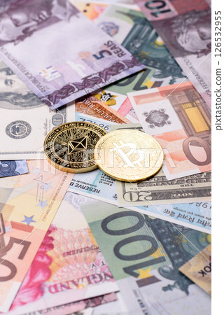 Round metal ethereum on a background of paper banknotes Round metal ethereum on a background of paper banknotes 126532955