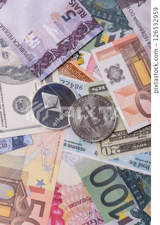 Round metal ethereum on a background of paper banknotes Round metal ethereum on a background of paper banknotes 126532959
