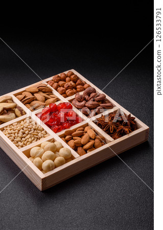Mix of macadamia, pine, cashew, hazelnut, peanut, pistachio nuts 126533791