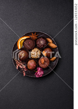 Homemade chocolate candies with different fillings and sprinkles 126533852