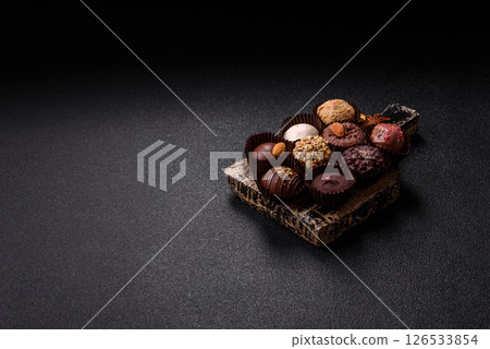 Homemade chocolate candies with different fillings and sprinkles 126533854