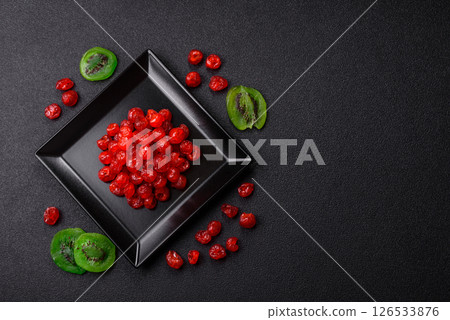 Dried sweet red pitted cherries or candied fruits Dried sweet red pitted cherries or candied fruits 126533876