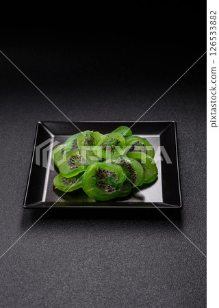 Dried sweet green kiwi or candied fruit Dried sweet green kiwi or candied fruit 126533882