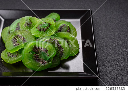 Dried sweet green kiwi or candied fruit 126533883