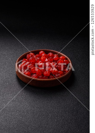 Dried sweet red pitted cherries or candied fruits 126533929