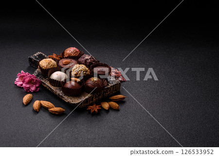 Homemade chocolate candies with different fillings and sprinkles Homemade chocolate candies with different fillings and sprinkles 126533952