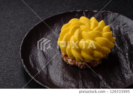 Round sweet tart of yellow color with citrus and passion fruit flavor Round sweet tart of yellow color with citrus and passion fruit flavor 126533995